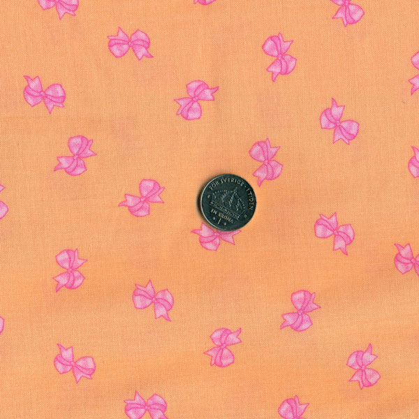2504, små rosetter på orange bas, tygbredd 110 cm